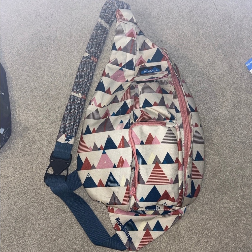 Kavu Geometric Pattern Sling Bag in Red, Blue, and Cream